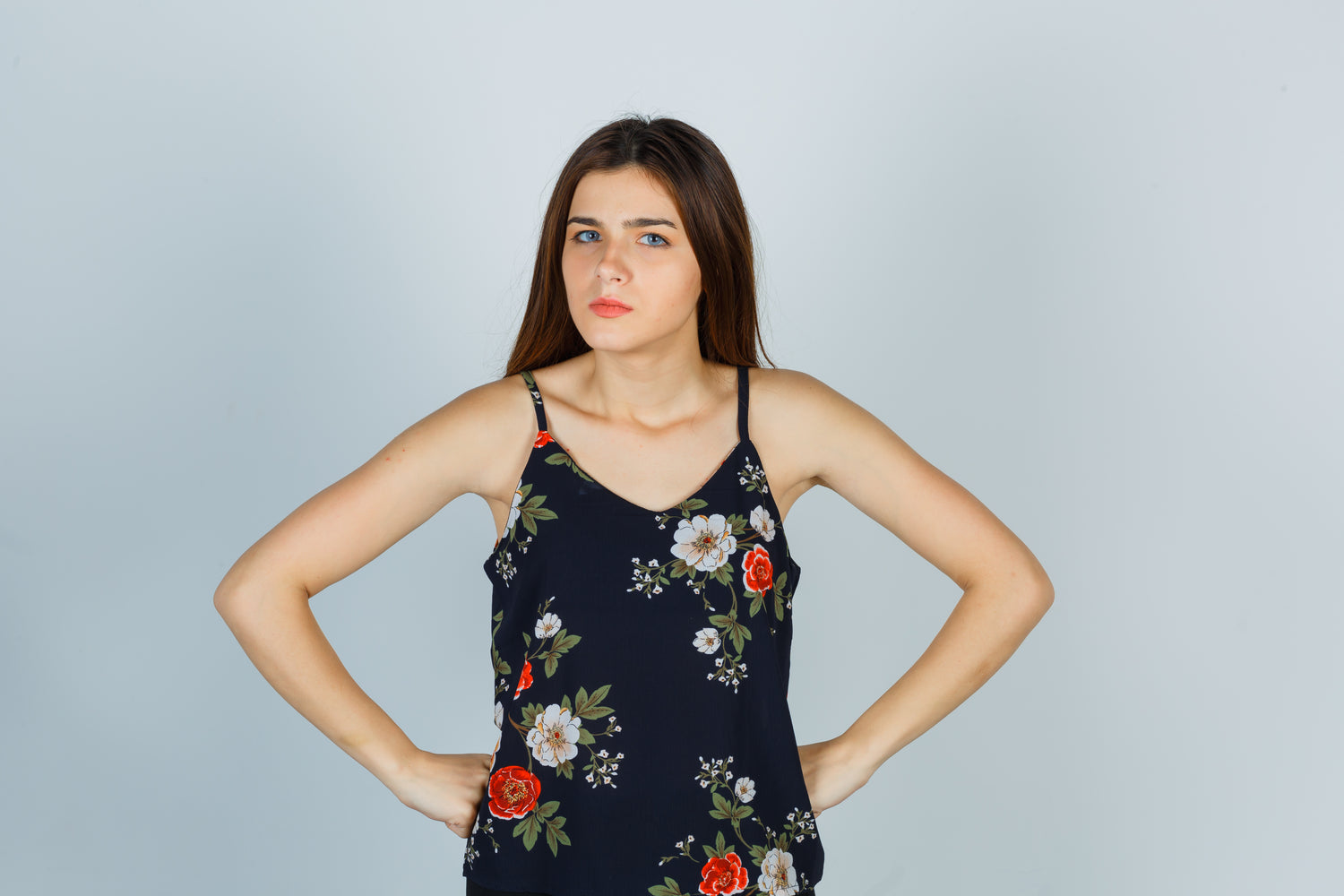 portrait-attractive-young-lady-holding-hands-waist-blouse-looking-serious-front-view-Nordavory